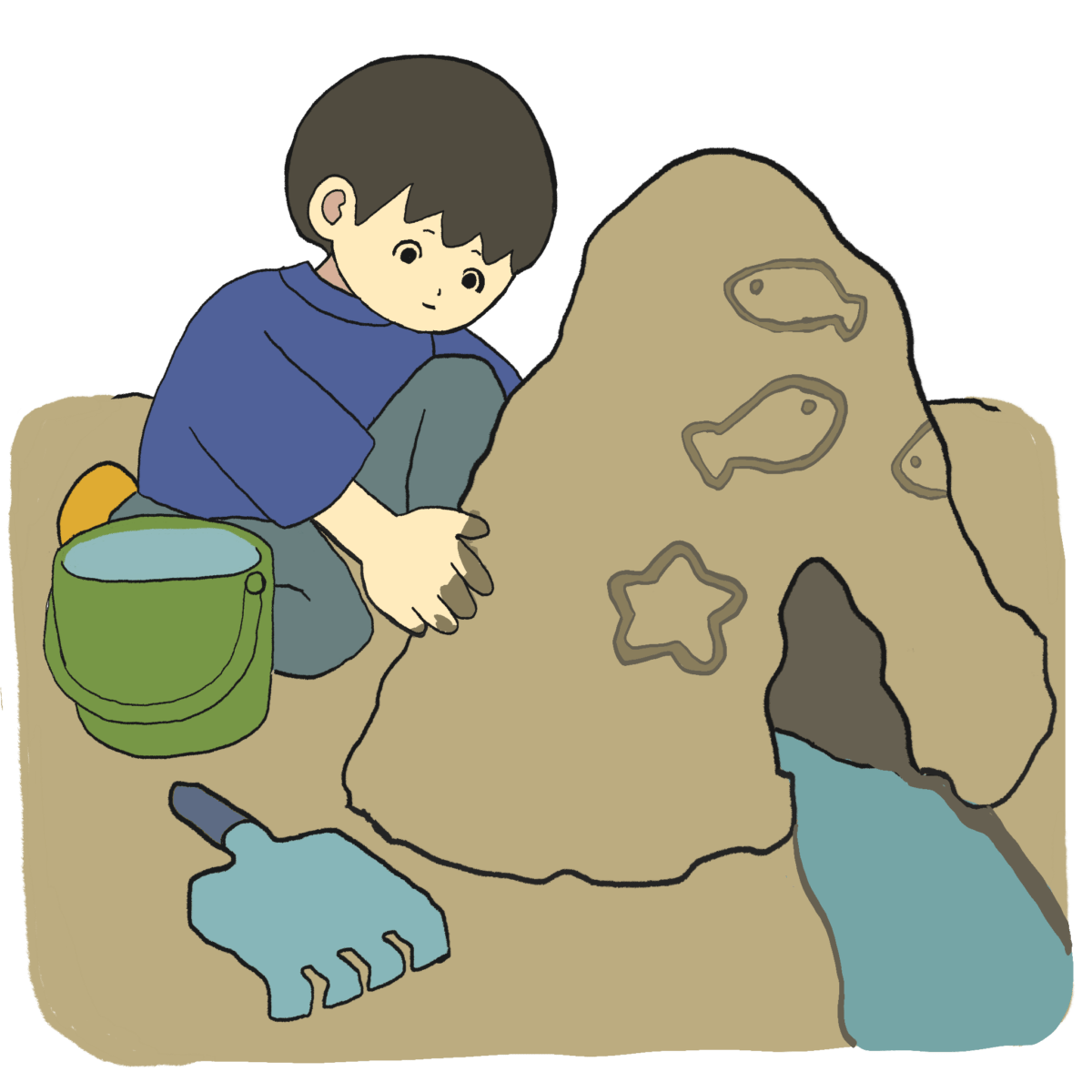 砂場で山を作って遊ぶ男の子
